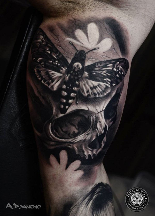 76-lobanja with moths tattoo