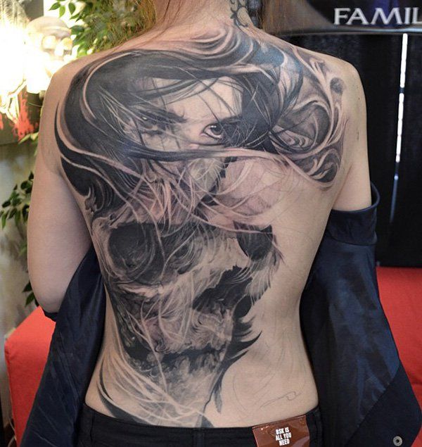 63-Girl and skull tattoo on back for woman