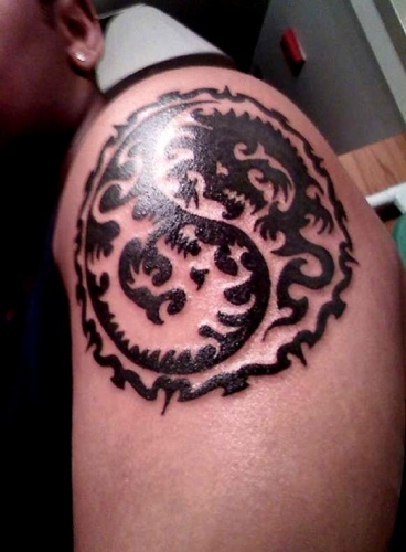 A tribal style dragon ying and yang