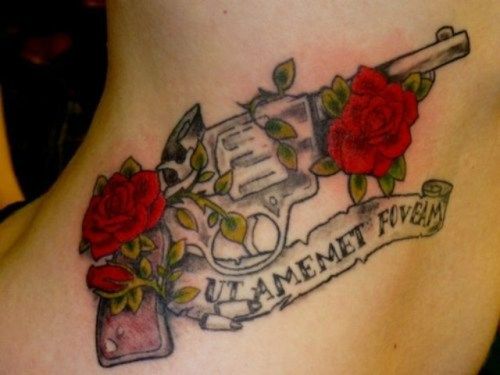 A gun with rose and thorns