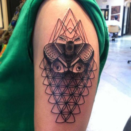 szentelt geometric half sleeve tattoo