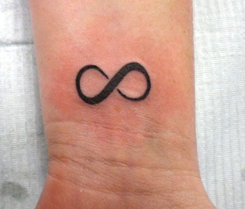 mic infinity symbolic tattoo on the wrist