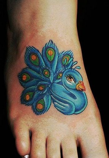 Gulbė with peacock tattoo 11