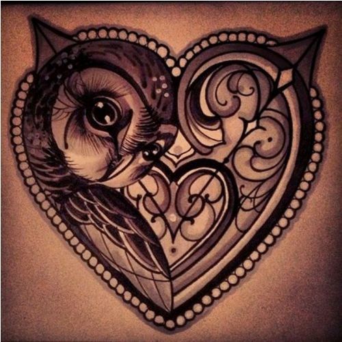 Blocat within a heart tattoo