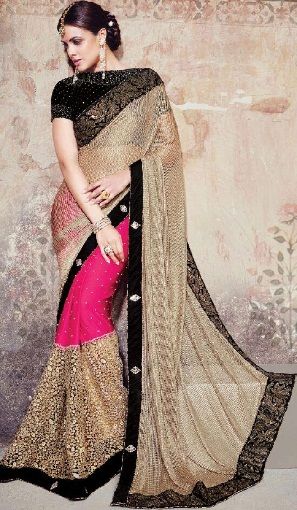 10. Stone worked beige coloured net bridal saree