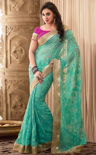 14. Turquoise net saree with golden border