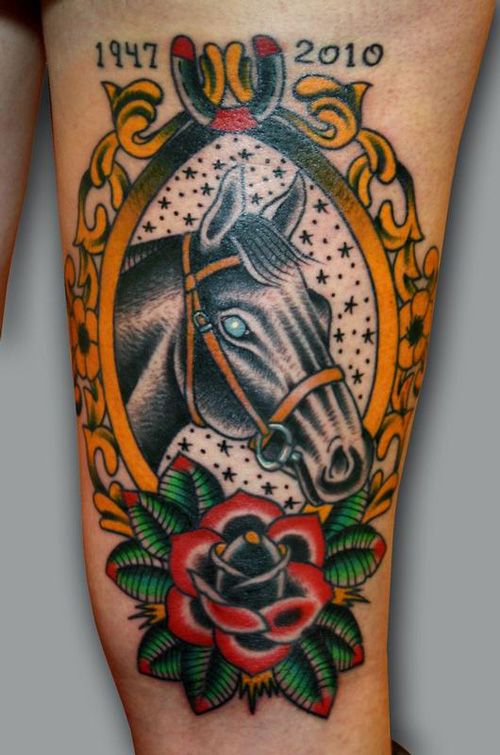 A horse face with flowers and other embellishments