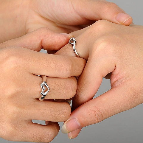 Couples hand and heart rings