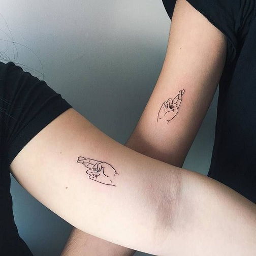25 Stylish & Cute Matching Tattoos for Couples - Matching Cross finger friend tattoo