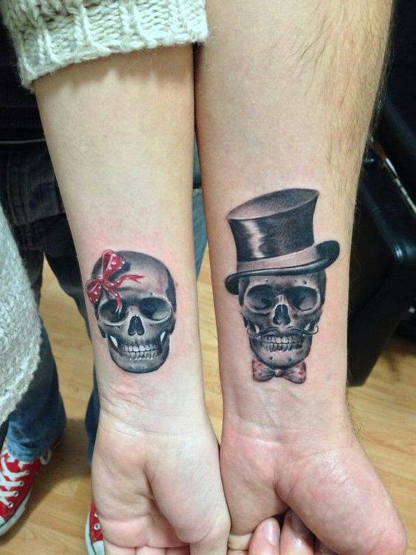 Matching Skull Tattoos On Couple Wris