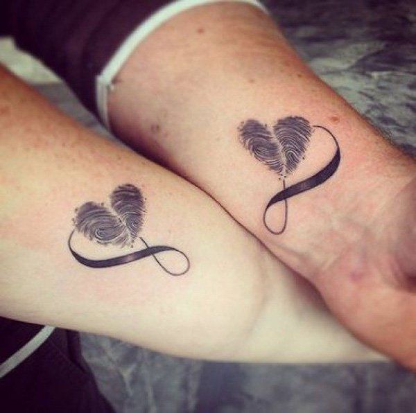 Couple With Matching Infinity Hearts Tattoo On Wrist