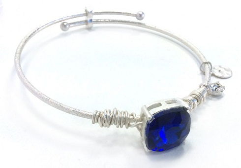 Blue sapphire square gemstone on a silver wire bracelet