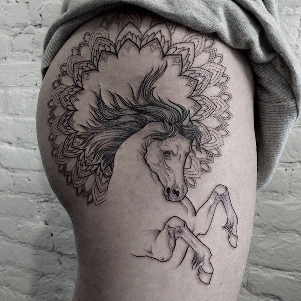 ló with mandala tattoo on thigh