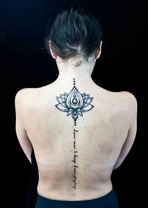 Lotus and fonts spine tattoo-18