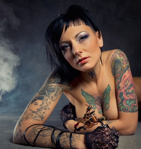 floare and gun tattoo for the breasts