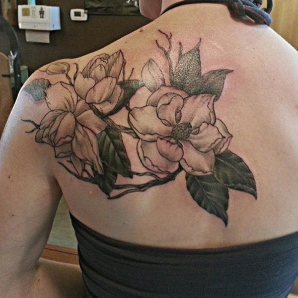 magnolia back tattoo for women