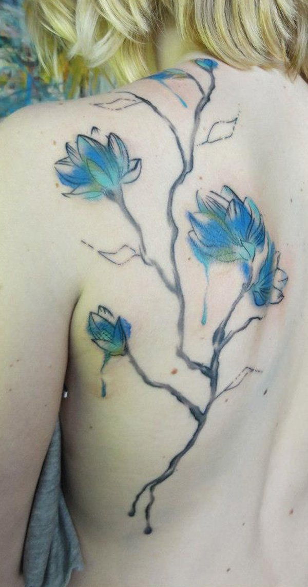 Watercolor magnolia back tattoo