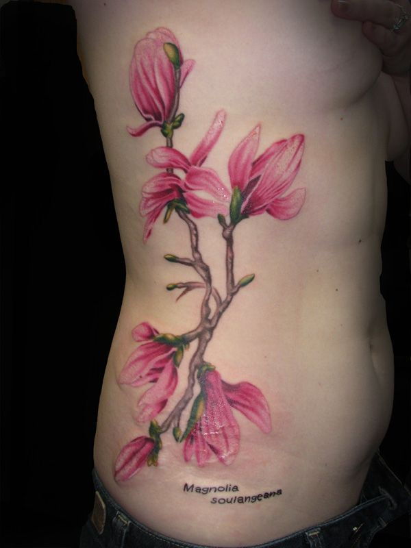 Colored magnolia side tattoo