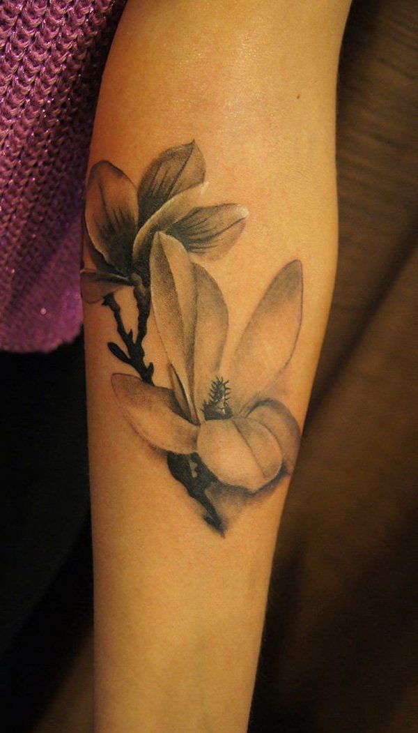 Black and white magnolia flower sleeve tattoo