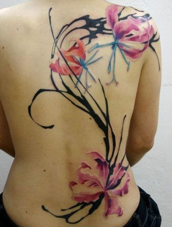 Elegant magnolia watercolor tattoo on full back for woman
