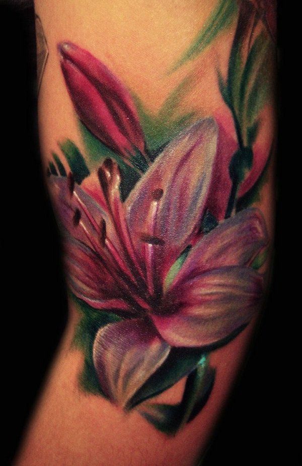 Realist pink lily tattoo on sleeve