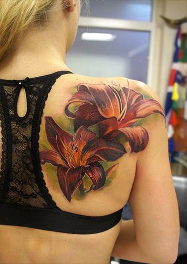 valószerű lily Tattoo on back by Andrey Grimmy