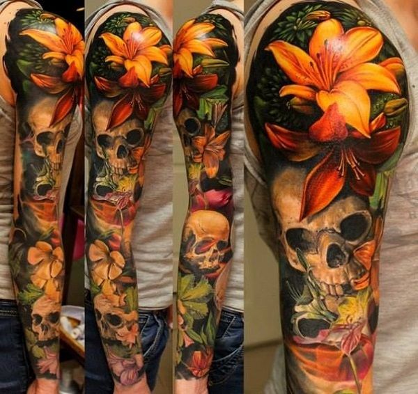 Realističen lily with skull tattoo on sleeve