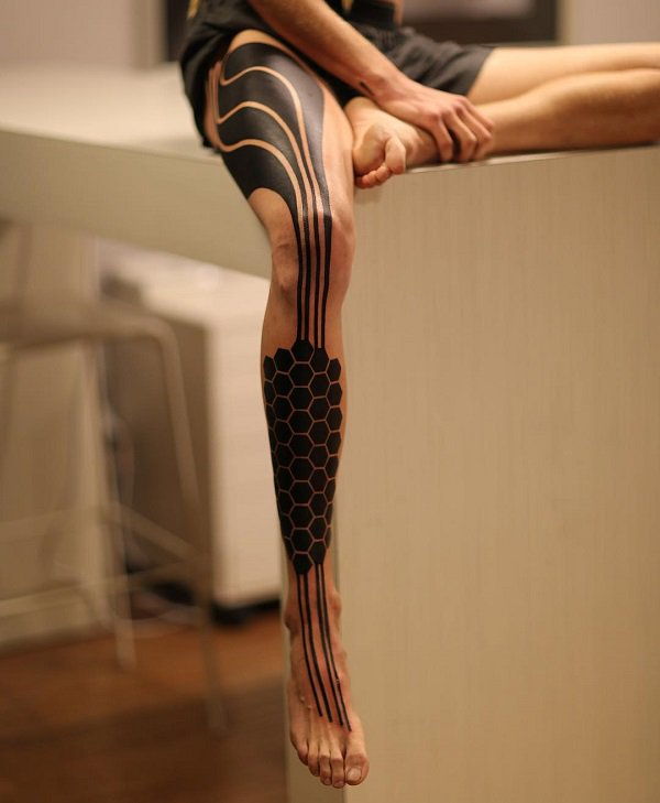 Saunus leg tattoo