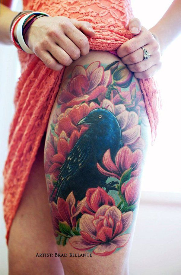 Corb and flowers thigh tattoo