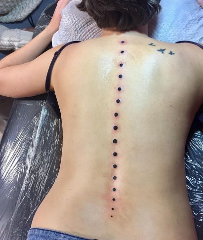 Juoda Dots Spinal Tattoo