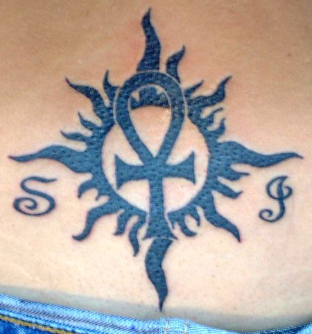 Kvailas radiating sun rays tribal sun tattoo