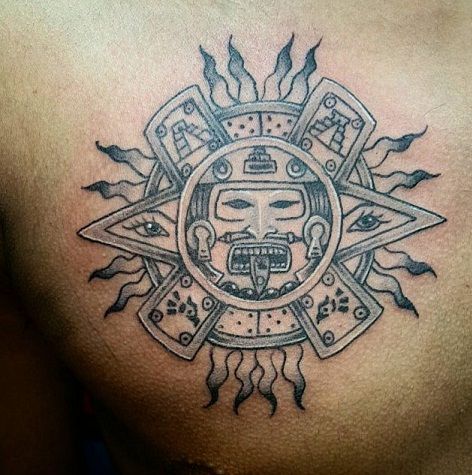 Angry face tribal Sun tattoo