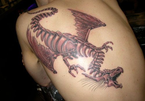 Skeletal dragon tribal tattoo