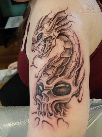 Dragon skull tribal tattoo