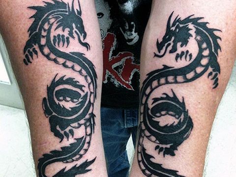 Twin dragon tribal tattoo