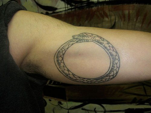 A Snake Eating its Tail Tattoo