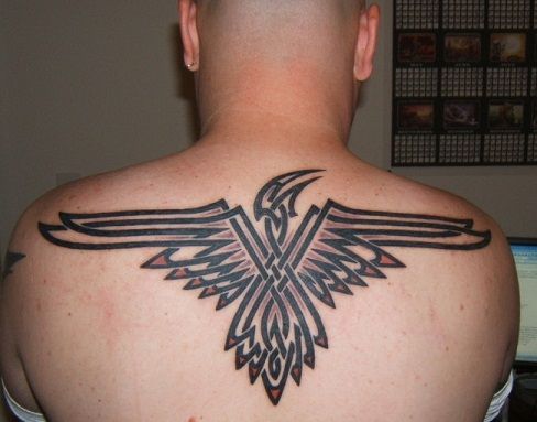 Egyptian Style Tribal Back Tattoo