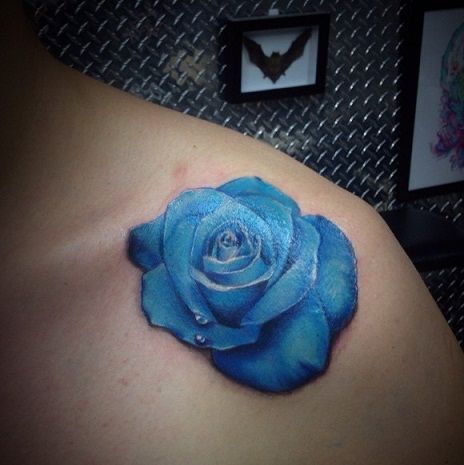 Blue rose collar bone tattoo