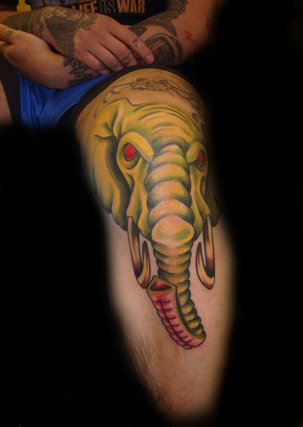 32 Volumetric yellow elephant tattoo on leg