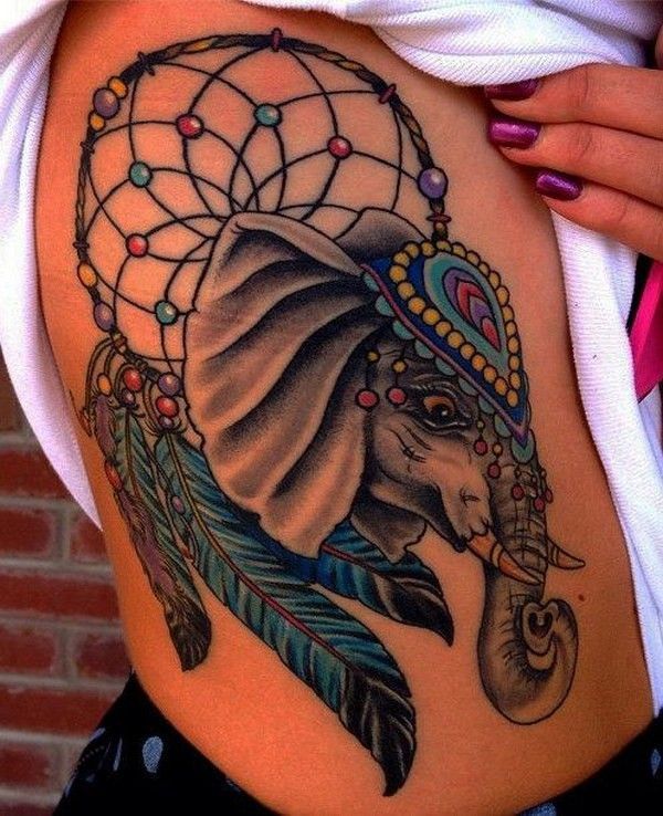 3 blue and grrey elephant tattoo with feathers on rib cage