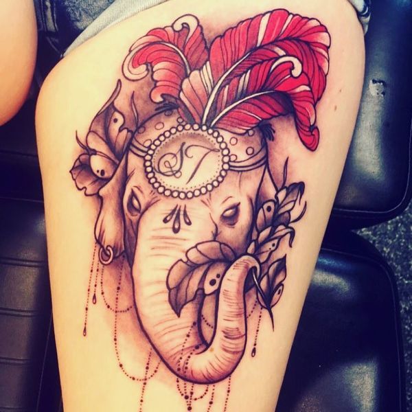 7 Royal greatness elephant head tattoo with red feathers on the hip