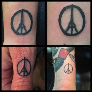 Peace Eiffel tower tattoos done in Canada by Eilo Martin.