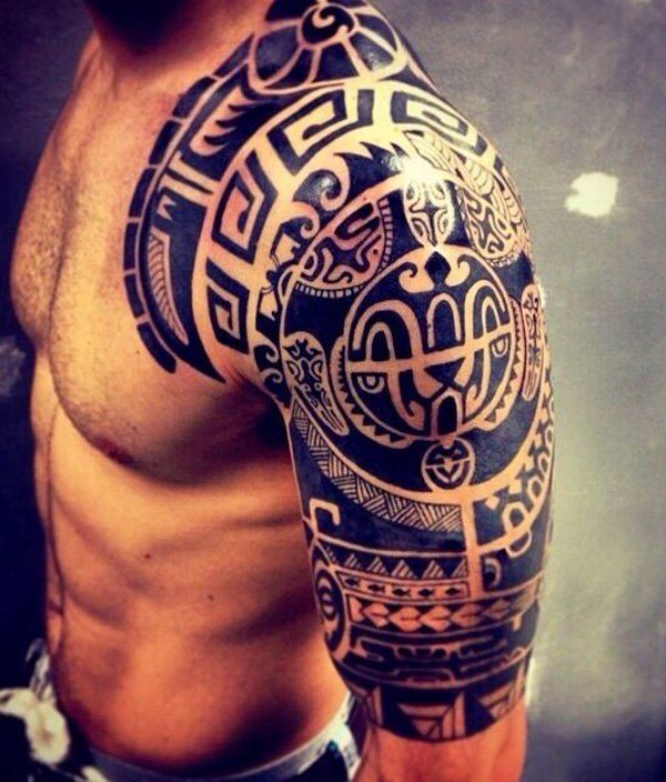 A Traditional Pacific Islander Tattoo Design covers the top half of the wearer’s arm and extends onto his chest and back.