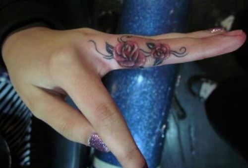 A floral concept middle finger tattoo