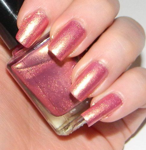 Roz Nail polishes golden shimmer on pink